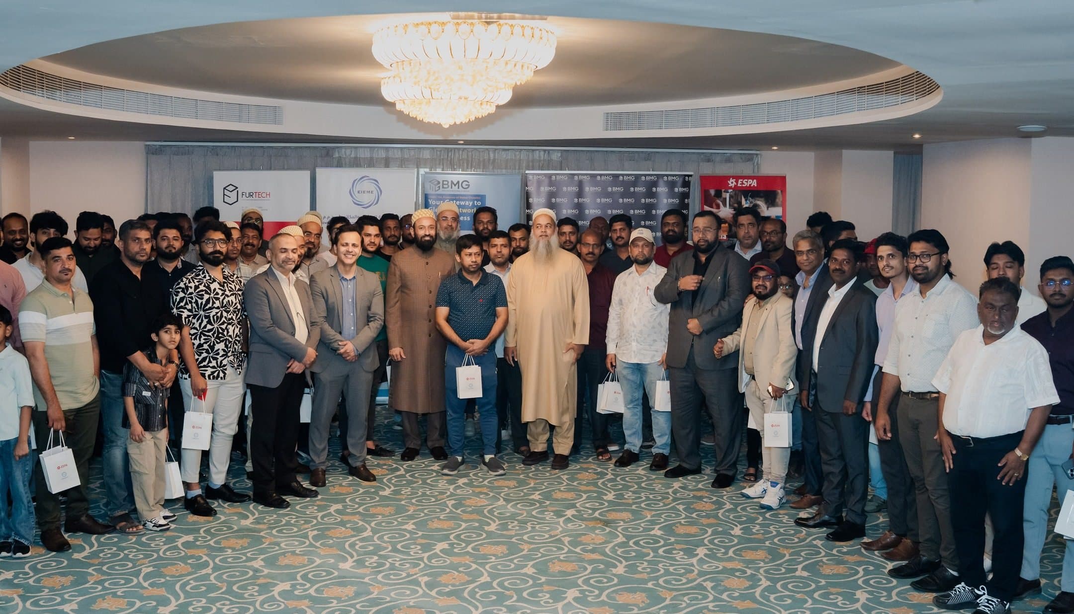 BMG Networking High-Tea, Qusais (Membership Drive): Large crowd of attendees posing together in a function room